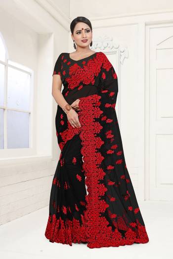 For A Bold And Beautiful Look, Grab This Heavy Embroidered Saree In Black Color. This Saree And Blouse are Fabricated On Net Beautified with Heavy Resham Embroidery And Moti Work In Contrasting Red Color Thread. Buy This Saree Now.