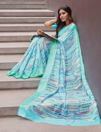 Grab This Petty Simple Saree In Aqua Blue Color Paired With Aqua Blue Colored Blouse. This Saree And Blouse Are Fabricated On Soft Linen Beautified With Lining Pints All Over. 