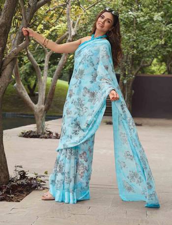 Grab This Petty Simple Saree In Sky Blue Color Paired With Blue Colored Blouse. This Saree And Blouse Are Fabricated On Soft Linen Beautified With Floral Pints All Over. 