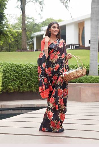 Here Is A Bold And Beautiful Looking Designer Printed Saree In Black Color Paired with Orange Colored Blouse. This Saree And Blouse Are Fabricated On Soft Line Beautified With Bold Floral Prints. Buy This Saree Now.