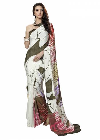 Add Some Casuals With This Pretty Saree Fabricated On Crepe. This Saree And Blouse are Beautified With prints And It Is Light Weight And Easy To Carry All Day Long