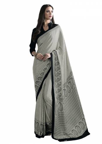 Add Some Casuals With This Pretty Saree Fabricated On Crepe. This Saree And Blouse are Beautified With prints And It Is Light Weight And Easy To Carry All Day Long