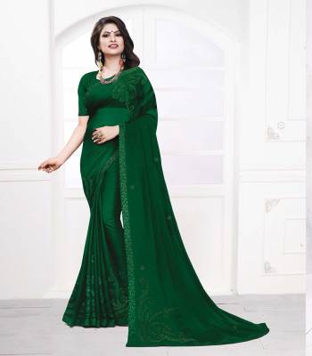 Celebrate This Festive Season With Beauty And Comfort Wearing This Designer Saree In Green Color. This Pretty Saree Is Fabricated On Satin Georgette Paired With art Silk Fabricated Blouse. It Is Light Weight And Easy To Carry All Day Long. 