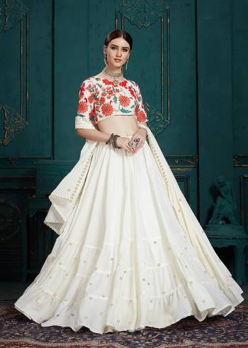 Simple And Elegant Looking Designer Lehenga Choli Is Here In All Over White Color. This Pretty Lehenga Choli Is Georgette Based. Its Pretty Blouse Is Beautified With Multi Colored Embroidery Giving It An Attractive Look.