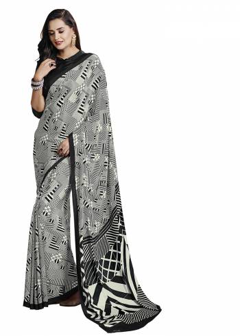 Add Some Casuals With This Pretty Saree Fabricated On Crepe. This?Saree And Blouse are Beautified With prints And It Is Light Weight And Easy To Carry All Day Lon