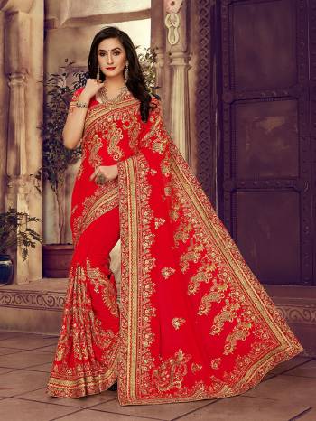 For The Upcoming Wedding Season, Here Is a Perfectly Suitable Saree In Red Color Paired With Red Colored Blouse. This Saree And Blouse Are fabricated On Georgette Beautified With Embroidery Highlighted With Stone Work. Buy This Beautiful Designer Saree Now.