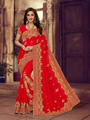 For The Upcoming Wedding Season, Here Is a Perfectly Suitable Saree In Red Color Paired With Red Colored Blouse. This Saree And Blouse Are fabricated On Georgette Beautified With Embroidery Highlighted With Stone Work. Buy This Beautiful Designer Saree Now.