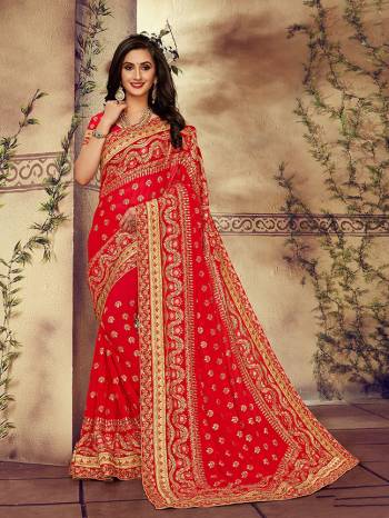 For The Upcoming Wedding Season, Here Is a Perfectly Suitable Saree In Red Color Paired With Red Colored Blouse. This Saree And Blouse Are fabricated On Georgette Beautified With Embroidery Highlighted With Stone Work. Buy This Beautiful Designer Saree Now.