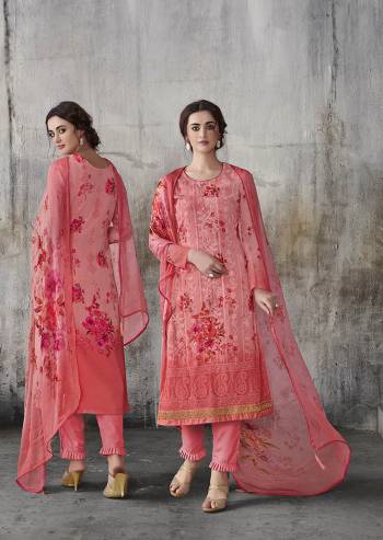 Flaunt Your Rich And Elegant Taste Wearing This Designer Straight Suit In Dark Peach Color. Its Top IS Fabricated on Georgette Beautified With Lakhnavi Work And Digital Prints, Paired With Santoon Bottom And Chiffon Fabricated Dupatta. 