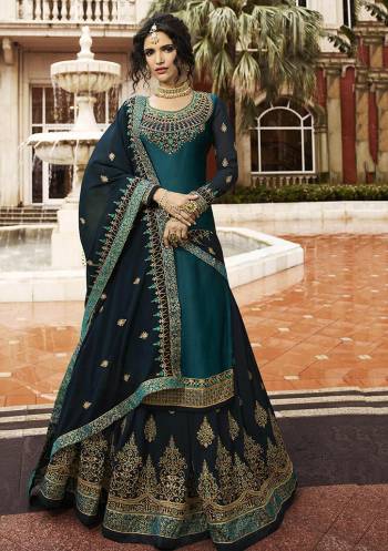 Beautiful Shade In Blue Is Here To Add Into Your Wardrobe With This Indo-Western Lehenga Suit In Teal Blue Color. Its Top Is Fabricated On Satin Georgette Paired With Heavy Embroidered Georgette Fabricated Lehenga And Dupatta. Buy Now.