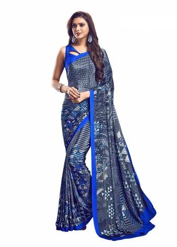 Add Some Casuals With This Pretty Saree Fabricated On Crepe. This?Saree And Blouse are Beautified With prints And It Is Light Weight And Easy To Carry All Day Long