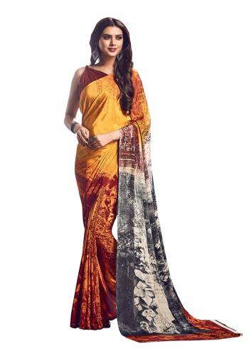 Add Some Casuals With This Pretty Saree Fabricated On Crepe. This?Saree And Blouse are Beautified With prints And It Is Light Weight And Easy To Carry All Day Long