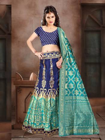 Go With Pretty Shades Of Blue Wearing This Heavy Weaved Designer Lehenga Choli In Navy Blue Color Paired With Blue Colored Dupatta. Its Blouse Is Fabricated On Banarasi Art Silk Paired With Banarasi Jacquard Silk  Lehenga And Dupatta. 