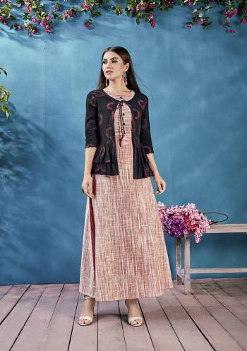 New And Unique Styled Readymade Long Kurti Is Here In Rust Color Paired With Black Colored Peplum Patterned Jacket. This Pair Of Kurti And Jacket Are Fabricated On Handloom Cotton Beautified With Prints. 