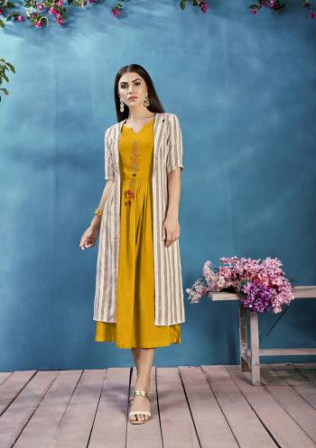 Celebrate This Festive Season With Beauty And Comfort Wearing This Readymade Deisgner Kurti In Musturd Yellow Color Paired With Beige And White Colored Jacket. Its Kurti Is Rayon Based paired With Handloom Cotton fabricated Jacket. Buy Now.