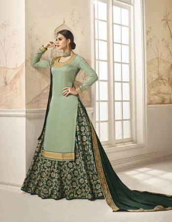 Flaunt Your Rich And Elegant Taste Wearing This Designer Indo-Western Suit In Light Green Colored Top Paired With Pine Green Colored Bottom And Dupatta. Its Embroidered Top Is Fabricated On Satin Silk Paired With Jacquard Silk Bottom And Georgette Silk Fabricated Dupatta. As Per Your Choice You Can Its Bottom Stitched As A Plazzo Or Skirt. 