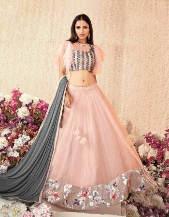 Feminine and frilly lehenga in the most beautiful shade of pink and hints of floral details makes this lehenga a piece that's wow-worthy. Pair it with swarvoski jewels for a classy appeal. 