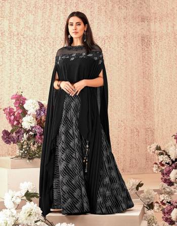 This black cocktail-lehenga with a cape blouse is alluring and artistic at the same time. Keep the look fresh and minmal to enhance the beauty of the outfit. 