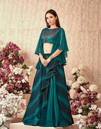 A design with asymetric cuts and bell sleeve blouse in the most gorgeous shade of teal ticks all the right boxes of fashion . Use the dupatta or go sans dupatta and look trendy 