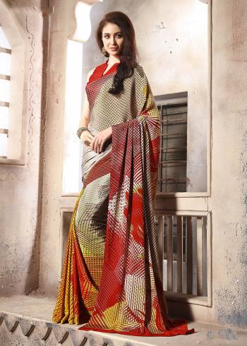 Add Some Casuals With This Pretty Saree Fabricated On Crepe. This Saree And Blouse are Beautified With prints And It Is Light Weight And Easy To Carry All Day Long