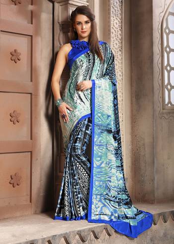 Add Some Casuals With This Pretty Saree Fabricated On Crepe. This Saree And Blouse are Beautified With prints And It Is Light Weight And Easy To Carry All Day Long