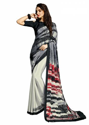 Add Some Casuals With This Pretty Saree Fabricated On Crepe. This?Saree And Blouse are Beautified With prints And It Is Light Weight And Easy To Carry All Day Long