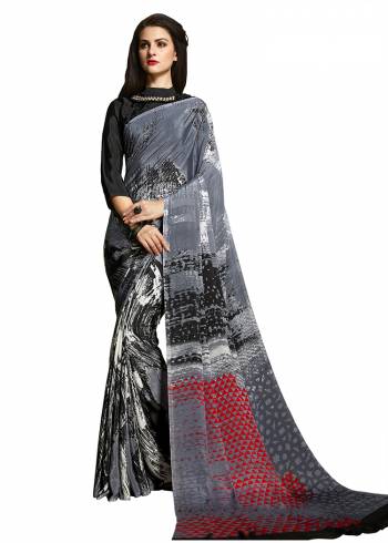 Add Some Casuals With This Pretty Saree Fabricated On Crepe. This?Saree And Blouse are Beautified With prints And It Is Light Weight And Easy To Carry All Day Long