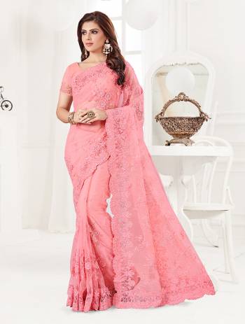 Here Is A Very Beautiful And Heavy Designer Saree In Pink Color. This Beautiful Heavy Embroidered Saree And Blouse Are Fabricated On Net Beautified With Pretty Tone To Tone Resham Embroidery And Ceramic Stone Work. Buy This Heavy Yet Subtle Looking Saree Now.