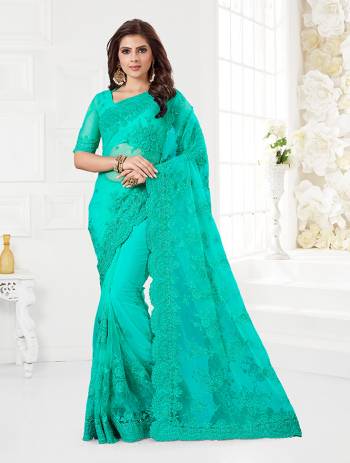 Here Is A Very Beautiful And Heavy Designer Saree In Se Green Color. This Beautiful Heavy Embroidered Saree And Blouse Are Fabricated On Net Beautified With Pretty Tone To Tone Resham Embroidery And Ceramic Stone Work. Buy This Heavy Yet Subtle Looking Saree Now.