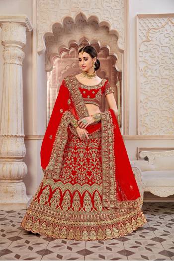 If You Want To Become The Most Attractive And Elegant Bride, Than?Grab This Heavy Designer Lehenga Choli In All Over Red Color. Its Heavy Embroidered Lehenga And Choli Are Fabricated On Velvet Paired With Net Fabricated Dupatta. It Beautiful Rich Color And Clean Embroidery Will Earn You lots Of Compliments From Onlookers.