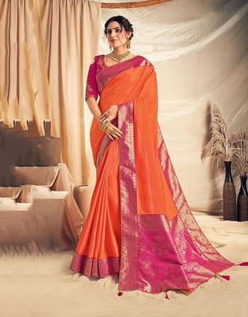 Light up your festivities with your impeccable sense of traditional choices in this bright orange and pink saree. Pair with kundan jewels to look like a queen. 