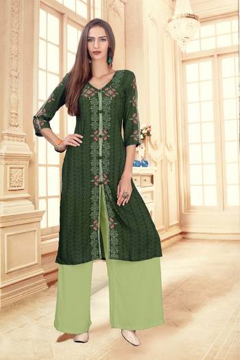 Add This Pretty Pair Of Readymade Kurti And Plazzo To Your Wardrobe In Dark Green And Light Green Color. This Pair Is Fabricated On Rayon Cotton Beautified With Digital Prints. 