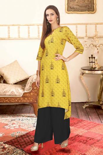 Add This Pretty Pair Of Readymade Kurti And Plazzo To Your Wardrobe In Yellow And Black Color. This Pair Is Fabricated On Rayon Cotton Beautified With Digital Prints. 