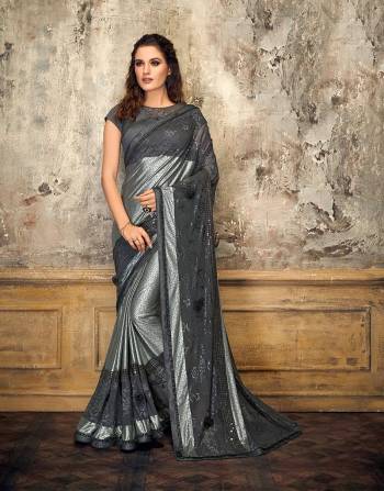 Let your sartorial choices speak volumes in this noteworthy grey glittery saree. Adorn it with delicate diamond jewels and look enchanting. 