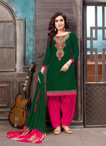 Attract All Wearing This Designer Patiala Suit In Dark Green Colored Top Paired With Rani Pink Colored Bottom And Dark Green Colored Dupatta. It Is Fabricated on Satin Cotton Paired With Cotton Bottom And Chiffon Fabricated Dupatta. 