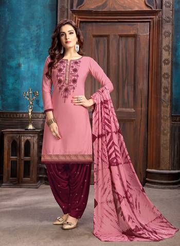 Add This Very Pretty Designer Patiala Suit To Your Wardrobe In Pink Colored Top Paired With Contrasting Maroon Colored Bottom And Pink Colored Dupatta. Its Top Is Fabricated On Cotton Satin Paired With Cotton Bottom And Chiffon Fabricated Dupatta. 