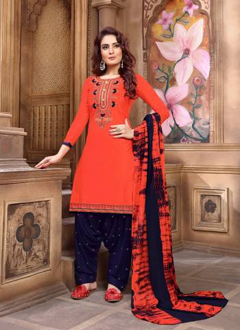 Shine Bright Wearing This  Designer Patiala Suit In Orange Colored Top Paired With Navy Blue Colored Bottom And A Shaded Navy Blue And Orange Colored Dupatta. Its Top Is Fabricated On Cotton Satin Paired With Cotton Bottom And Chiffon Fabricated Dupatta. 