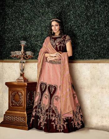 Let luxury become and experience with this regal brocade and velvet lehenga with exquisite embroidery details. Pair with elegant jewelry to complete the look. 