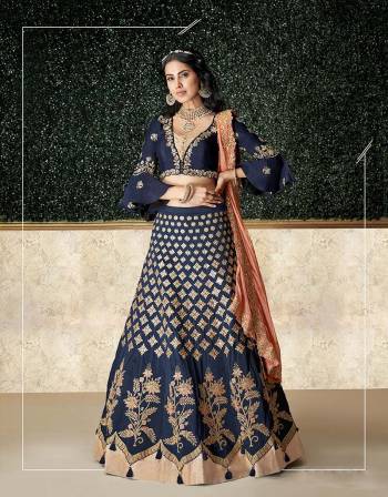 A resplendent confluence of bollywood style and cultural aesthetics , this youthful lehenga will take your fashion sense a notch higher .Drape the dupatta on your neck for that perfect look. 