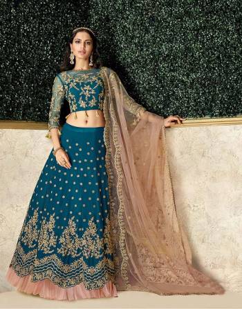 Trending frills added to an evergreen lehenga makes for an exemplary style. The added tassels on the blouse hem makes the design noteworthy. 