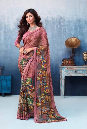 Here Is A Beautiful Printed Saree In Dusty Pink Color For the Upcoming Festive Season. This Pretty Saree Is Fabricated On Georgette Paired With Art Silk Fabricated Blouse. It Is Beautified With Prints And Lace Border. 