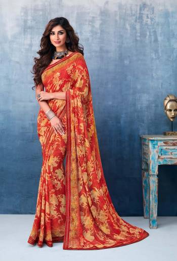 Here Is A Beautiful Printed Saree In Red Color For the Upcoming Festive Season. This Pretty Saree Is Fabricated On Georgette Paired With Art Silk Fabricated Blouse. It Is Beautified With Prints And Lace Border. 