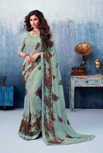 Simple And Elegant Looking Printed Saree Is Here In Aqua Blue Color. This Printed Saree Is Georgette Based Paired With Art Silk Fabricated Blouse. It Is Beautified With Fancy Lace Border.