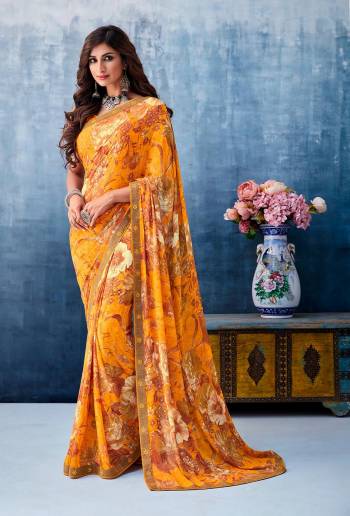 Here Is A Beautiful Printed Saree In Musturd Yellow Color For the Upcoming Festive Season. This Pretty Saree Is Fabricated On Georgette Paired With Art Silk Fabricated Blouse. It Is Beautified With Prints And Lace Border. 