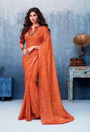 Here Is A Beautiful Printed Saree In Orange Color For the Upcoming Festive Season. This Pretty Saree Is Fabricated On Chiffon Paired With Art Silk Fabricated Blouse. It Is Beautified With Prints And Lace Border. 