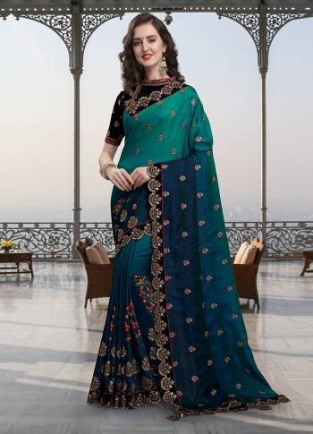 Here Is A Very Pretty Shaded Designer Saree In Shades Of Blue And Navy Blue Color Paired With Black Colored Blouse. This Embroidered Saree Is Fabricated On Soft Silk Paired With Heavy Embroidered Velvet Fabricated Blouse. 