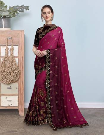 Here Is A Very Pretty Shaded Designer Saree In Shades Of Pink And Wine Color Paired With Dark Wine Colored Blouse. This Embroidered Saree Is Fabricated On Soft Silk Paired With Heavy Embroidered Velvet Fabricated Blouse. 