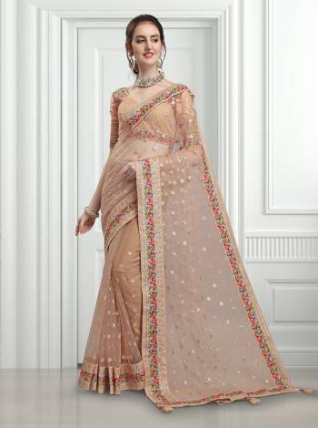 Flaunt Your Rich And Elegant Taste Wearing This Heavy Designer Saree In Beige Color Paired With Beige Colored Blouse. This Heavy Detailed Embroidered Saree In Fabricated on Net Paired With Art Silk Fabricated Blouse. Buy Now.