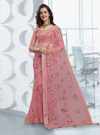 This Wedding Season Be Most Prettiest One Wearing This Heavy Designer Saree In Pink Color Paired With Pink Colored Blouse, This Saree And Blouse Are Fabricated On Net Beautified With Attractive Embroidery All Over. Buy Now.