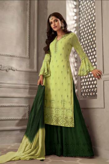 Grab This Very Beautiful Designer Sharara Suit In Light Green Colored Top Paired With Contrasting Dark Green Colored Bottom And Shaded Dark Green And Light Green Colored Dupatta. Its Embroidered Top Is Fabricated On Georgette Paired With Santoon Bottom And Chiffon Fabricated Dupatta. Its Pretty Color Pallete And Embroidery Will Earn You Lots Of Compliments From Onlookers. 